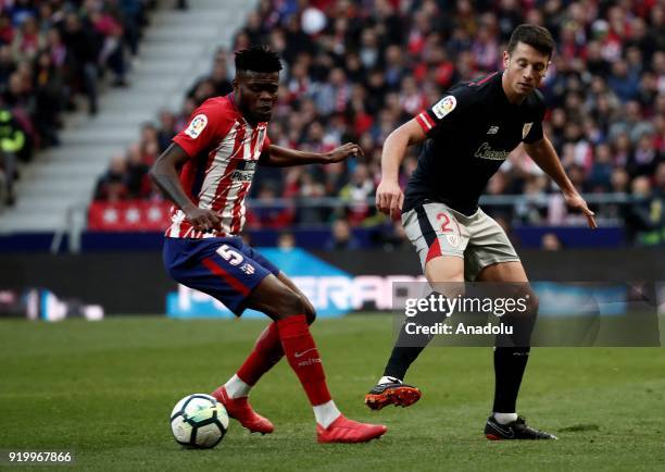 Thomas Partey of Atletico Madrid in action against Mikel Vesga of Athletic Club Bilbao during a La Liga week 24 match between Atletico Madrid and...