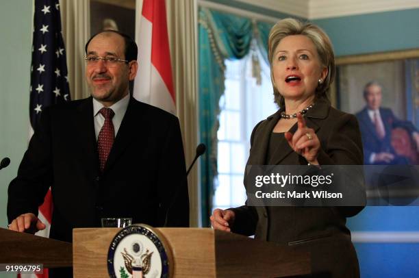 Secretary of State Hillary Clinton and Prime Minister of Iraq Nouri al-Maliki talk to reporters after a meeting at the State Department on October...