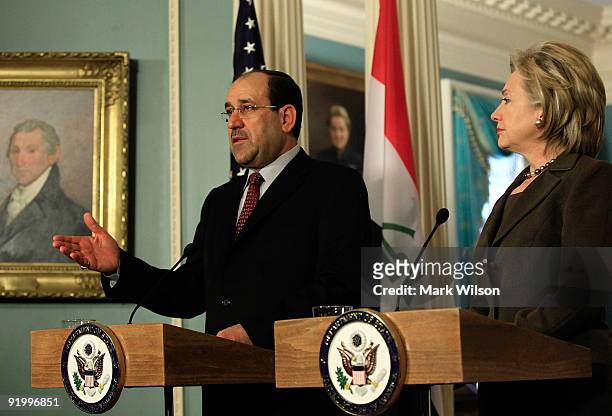 Secretary of State Hillary Clinton and Prime Minister of Iraq Nouri al-Maliki talk to reporters after a meeting at the State Department on October...