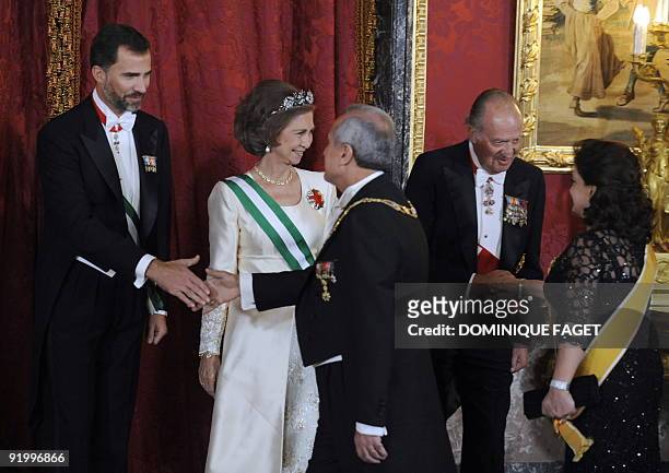 Spain's Prince Felipe flakned by Queen Sofia of Spain shakes hands with Lebanon's President Michel Sleiman , as first lady of Lebanon Wafaa Sleiman...