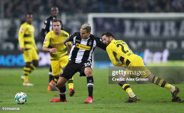 Raul Bobadilla of Moenchengladbach is held by Gonzalo Castro of Dortmund during the Bundesliga match between Borussia Moenchengladbach and Borussia...