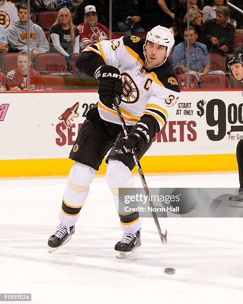 Zdeno Chara of the Boston Bruins passes the puck up ice against the Phoenix Coyotes on October 17, 2009 at Jobing.com Arena in Glendale, Arizona.