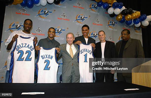 Rod Grizzard, Juan Dixon, owner Abe Pollin, Jared Jeffries, Head coach Doug Collins and General Manager Wes Unseld of the Washington Wizards pose...