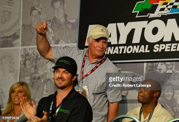 Tampa Bay Buccaneers defensive coordinator Mike Smith waves to the crowd during the drivers meeting for the Monster Energy NASCAR Cup Series 60th...