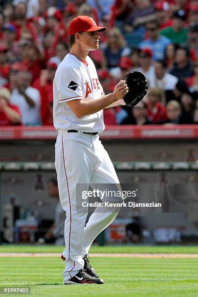 Jered Weaver of the Los Angeles Angels of Anaheim reacts after Melky Cabrera of the New York Yankees gounds out to second base ending the second...