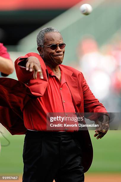 Hall of Famer Rod Carew throws out the first pitch prior to the start of Game Three of the ALCS between the Los Angeles Angels of Anaheim and the New...