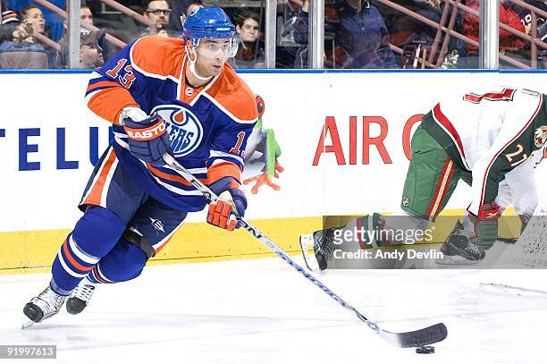 Andrew Cogliano of the Edmonton Oilers skates with the puck against the Minnesota Wild at Rexall Place on October 16, 2009 in Edmonton, Alberta,...