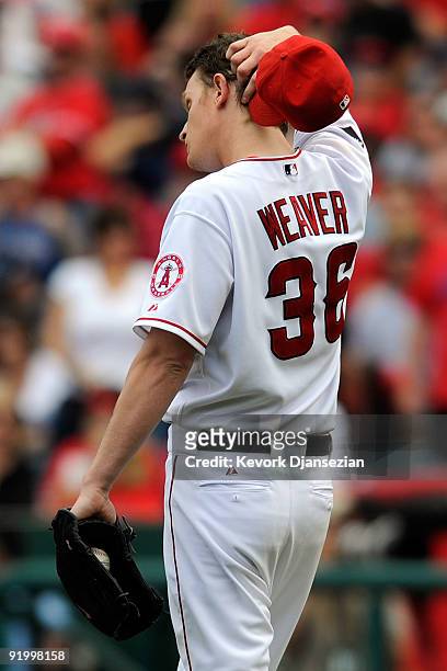Jered Weaver of the Los Angeles Angels of Anaheim reacts after Johnny Damon of the New York Yankees hit a home run during the fifth inning in Game...