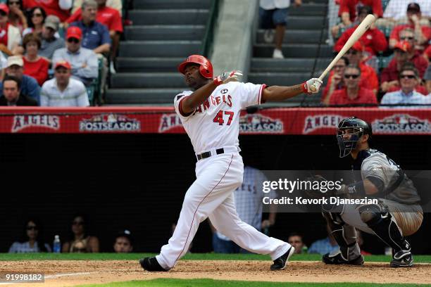 Howie Kendrick of the Los Angeles Angels of Anaheim hits a home run off Andy Pettitte of the New York Yankees during the fifth inning in Game Three...