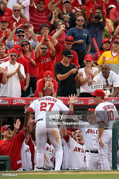 Vladimir Guerrero of the Los Angeles Angels of Anaheim celebrates with teammates after hitting a two run home run off Andy Pettitte of the New York...