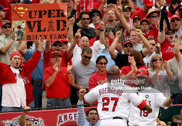 Vladimir Guerrero of the Los Angeles Angels of Anaheim celebrates with teammate Kendry Morales after hitting a two run home run off Andy Pettitte of...