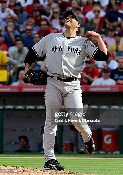 Andy Pettitte of the New York Yankees reacts after Vladimir Guerrero of the Los Angeles Angels of Anaheim hit a two run home run during the sixth...