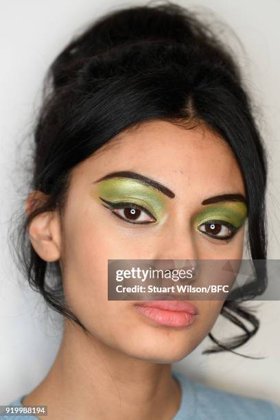 Model backstage ahead of the Ashish show during London Fashion Week February 2018 at BFC Show Space on February 18, 2018 in London, England.