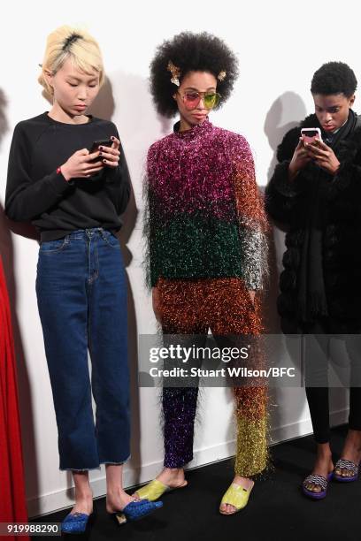 Models backstage ahead of the Ashish show during London Fashion Week February 2018 at BFC Show Space on February 18, 2018 in London, England.