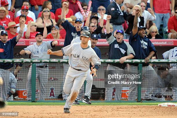 Jorge Posada of the New York Yankees rounds the bases after hitting a home run during the eighth inning off Kevin Jepsen of the Los Angeles Angels of...