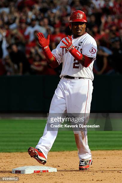 Erick Aybar of the Los Angeles Angels of Anaheim reacts after hitting a double off Joba Chamberlain of the New York Yankees during the seventh inning...
