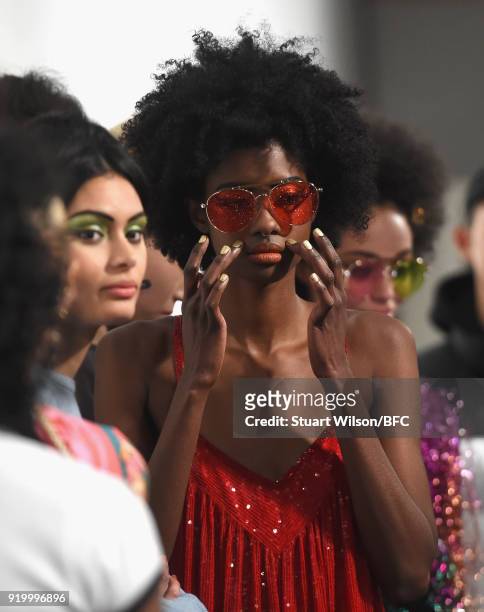 Model backstage ahead of the Ashish show during London Fashion Week February 2018 at BFC Show Space on February 18, 2018 in London, England.