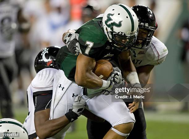 Quarterback B.J. Daniels of the South Florida Bulls runs the ball against the Cincinnati Bearcats during the game at Raymond James Stadium on October...