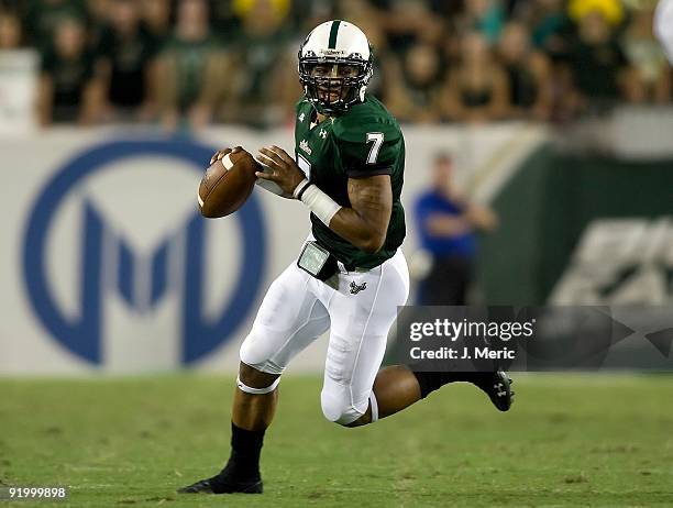 Quarterback B.J. Daniels of the South Florida Bulls looks for an open receiver against the Cincinnati Bearcats during the game at Raymond James...