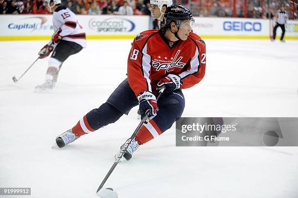 Alexander Semin of the Washington Capitals handles the puck against the New Jersey Devils at the Verizon Center on October 12, 2009 in Washington, DC.