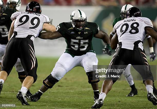 Offensive lineman Jeremiah Warren of the South Florida Bulls blocks against the Cincinnati Bearcats during the game at Raymond James Stadium on...