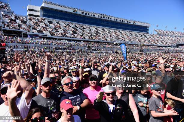 The crowd watches as Rascal Flats performs during pre race festivities prior to the start of the Monster Energy NASCAR Cup Series 60th Annual Daytona...