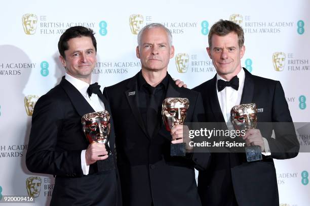 Pete Czernin, Martin McDonagh and Graham Broadbent, winner of the Outstanding British Film award, pose in the press room during the EE British...