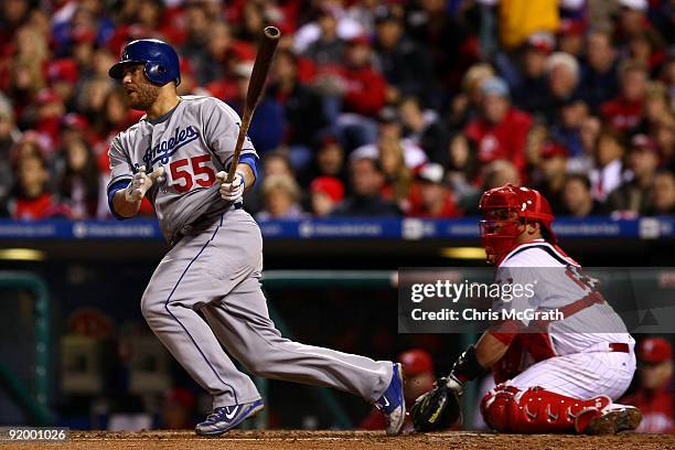 Russell Martin of the Los Angeles Dodgers hits a RBI single in the top of the fourth inning against of the Philadelphia Phillies in Game Four of the...