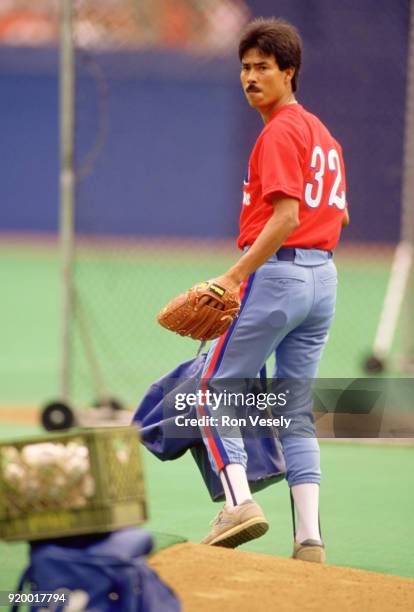 Dennis Martinez of the Montreal Expos looks on during an MLB game versus the St. Louis Cardinals at Busch Stadium in St. Louis, Missouri during the...