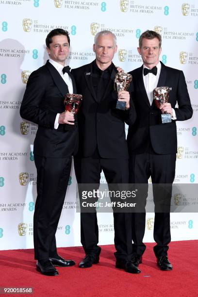 Pete Czernin, Martin McDonagh and Graham Broadbent, winner of the Outstanding British Film award, pose in the press room during the EE British...