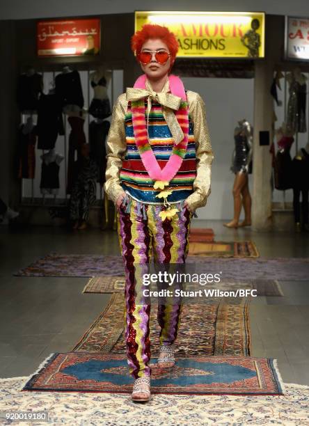 Model walks the runway at the Ashish show during London Fashion Week February 2018 at BFC Show Space on February 18, 2018 in London, England.