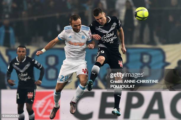Olympique de Marseille's French forward Valere Germain vies with Bordeaux's Danish midfielder Lukas Lerager during the French L1 football match...