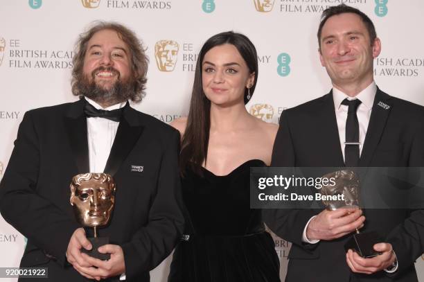 Hayley Squires poses with Paul Machliss and Jonathan Amos, winners of the Best Editing award for "Baby Driver", in the press room during the EE...