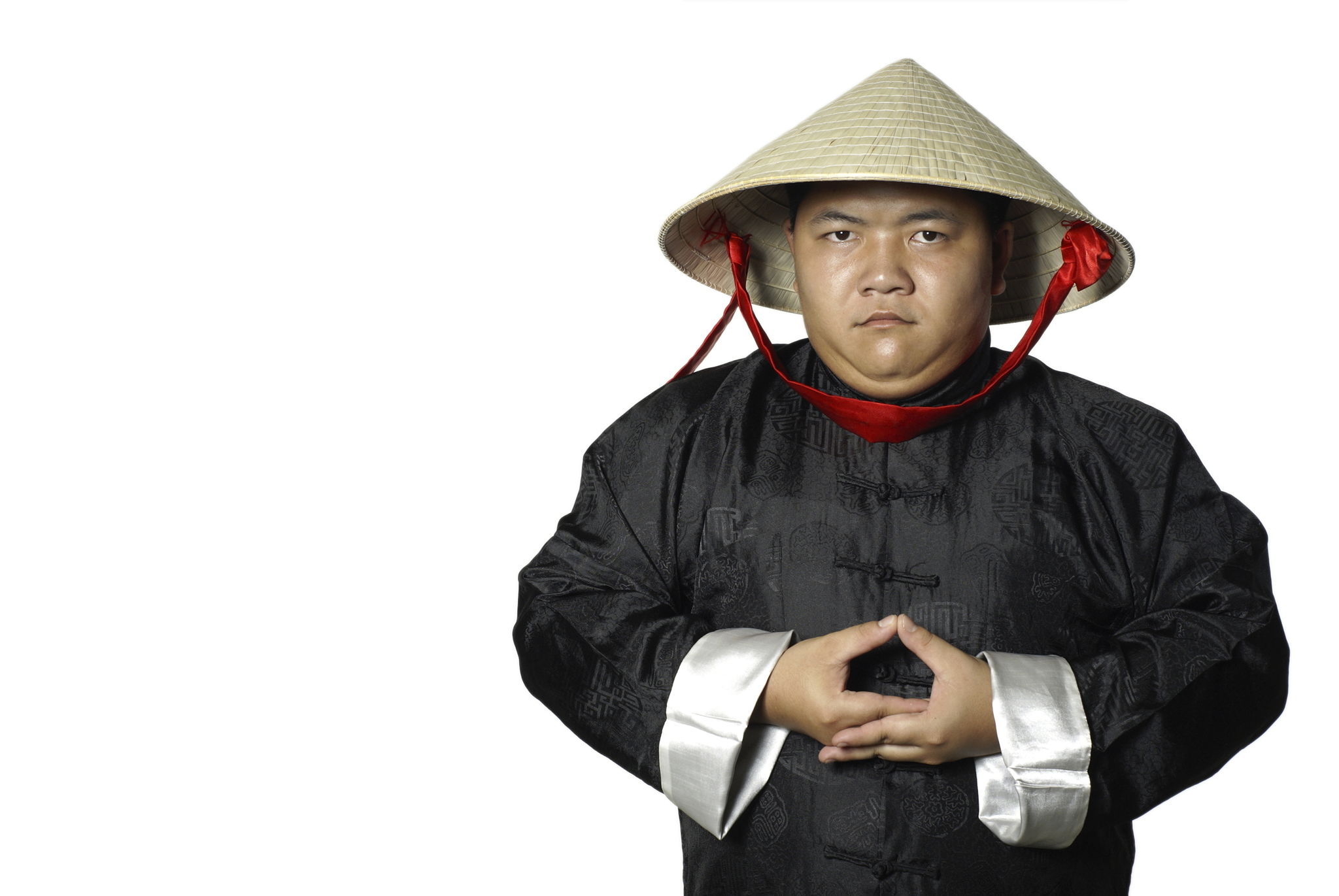 Asian man in traditional chinese costume meditating Asian man in traditional chinese costume meditating