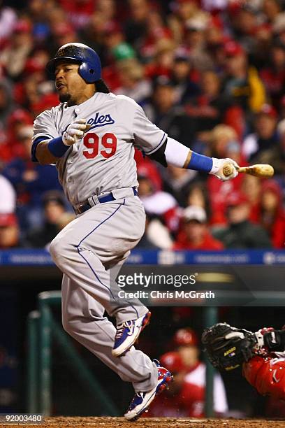 Manny Ramirez of the Los Angeles Dodgers reacts as he fouls a ball off of his foot in the top of the sixth inning against of the Philadelphia...