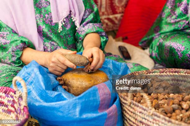 woman on argan oil factory in morocco - argan oil stockfoto's en -beelden