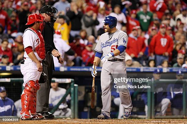 Russell Martin of the Los Angeles Dodgers argues with home plate umpire Ted Barrett after Martin was called out on strikes in the top of the sixth...