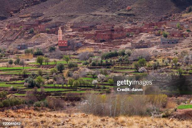 traditional berber village in atlas mountains, morocco, africa - atlas mountains stock-fotos und bilder