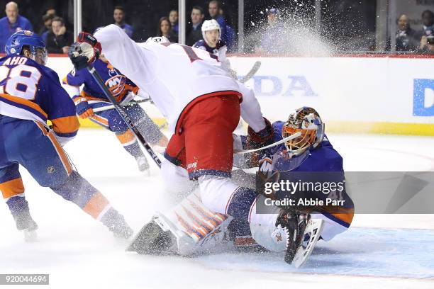 Josh Anderson of the Columbus Blue Jackets collides with Jaroslav Halak of the New York Islanders in the first period during their game at Barclays...