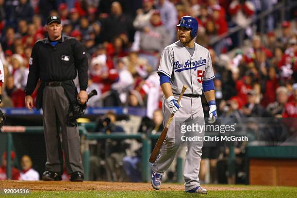 Russell Martin of the Los Angeles Dodgers walks back to the dugout dejected after he argued with home plate umpire Ted Barrett after Martin was...