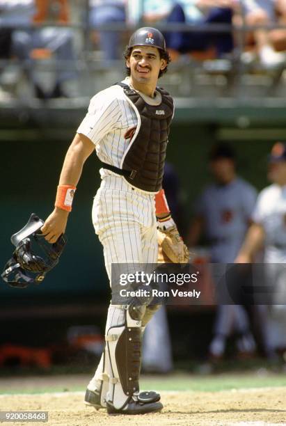 Benito Santiago of the San Diego Padres catches during an MLB game at Jack Murphy Stadium in San Diego, California during the 1988 season.