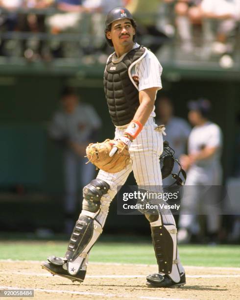 Benito Santiago of the San Diego Padres catches during an MLB game at Jack Murphy Stadium in San Diego, California during the 1988 season.