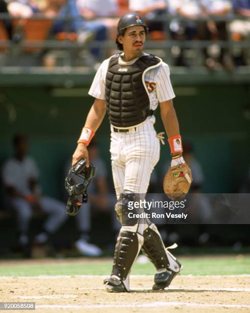 Benito Santiago of the San Diego Padres catches during an MLB game at Jack Murphy Stadium in San Diego, California during the 1988 season.