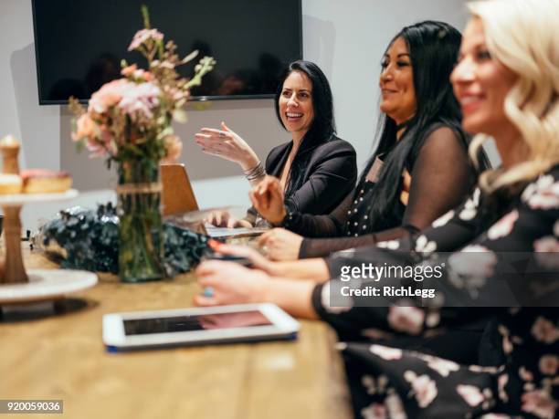 people working in a cafe coffee shop meeting space - event planner stock pictures, royalty-free photos & images