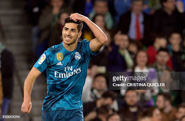 Real Madrid's Spanish midfielder Marco Asensio celebrates scoring a goal during the Spanish league football match Real Betis vs Real Madrid at the...