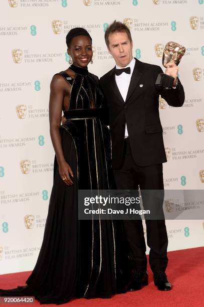 Presenter Lupita Nyong'o and winner of the Supporting Actor Award for 'Three Billboards Outside Ebbing, Missouri', Sam Rockwell pose in the press...