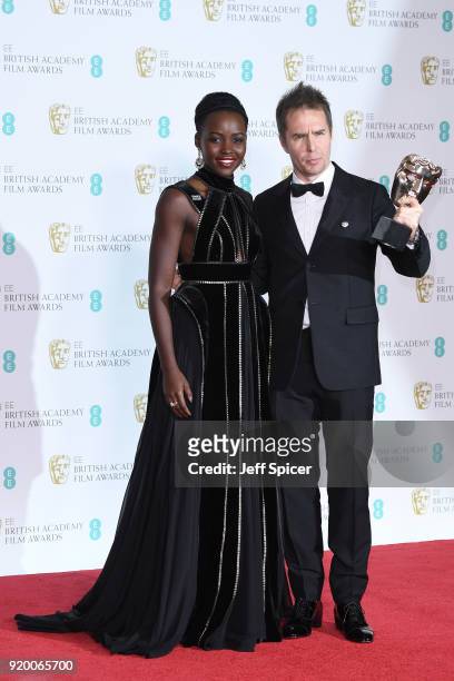 Presenter Lupita Nyong'o and Sam Rockwell, winner of the Best Supporting Actor award for the movie "Three Billboards Outside Ebbing, Missouri" pose...