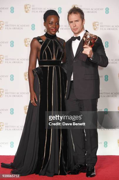 Lupita Nyong'o and Sam Rockwell, winner of the Best Supporting Actor award for "Three Billboards Outside Ebbing, Missouri", pose in the press room...