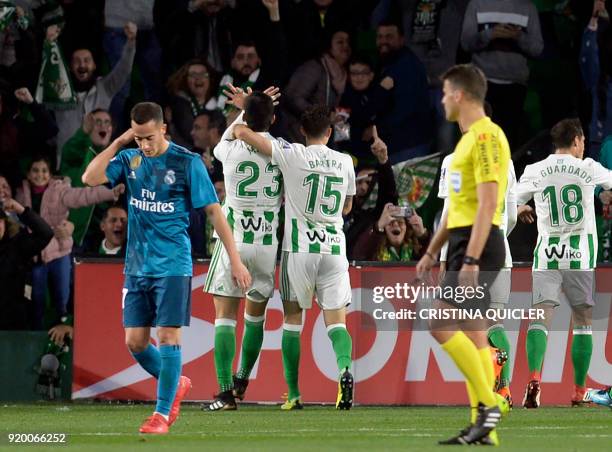 Real Betis' French defender Mandi celebrates scoring a goal during the Spanish league football match Real Betis vs Real Madrid at the Benito...