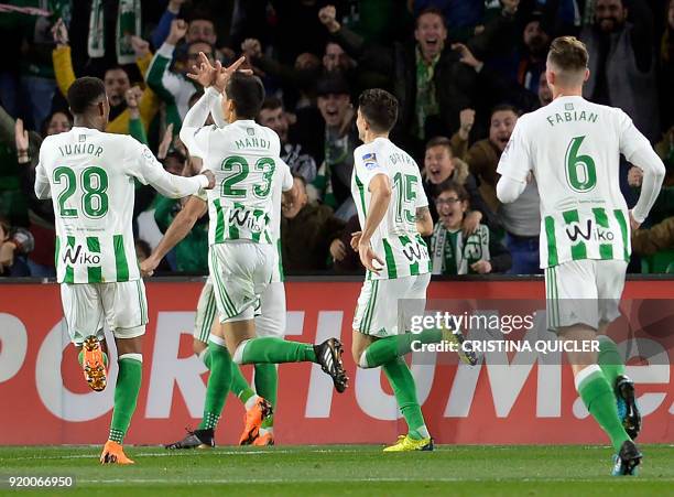 Real Betis' Algerian defender Aissa Mandi celebrates scoring a goal during the Spanish league football match Real Betis vs Real Madrid at the Benito...